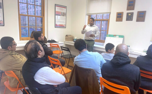 Afghan refugees in a financial workshop